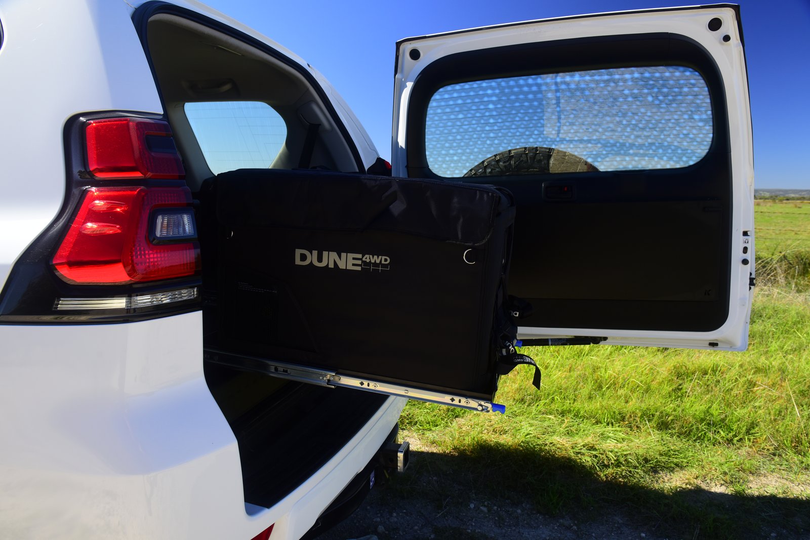 The fridge slide deployed, holding the fridge clear of the rear of the truck