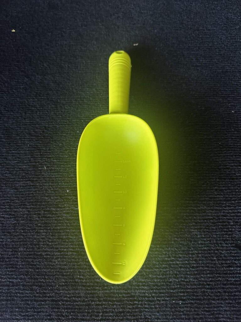 Green plastic nugget scoop for gold prospecting