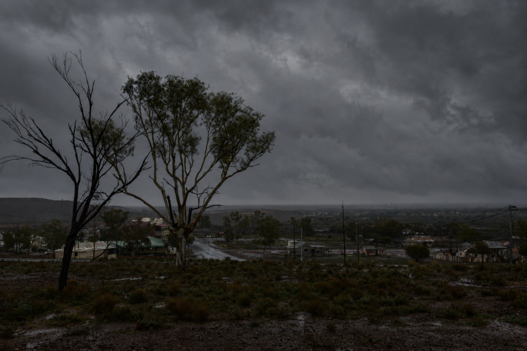 The Gwalia ghost town under a black storm cloud