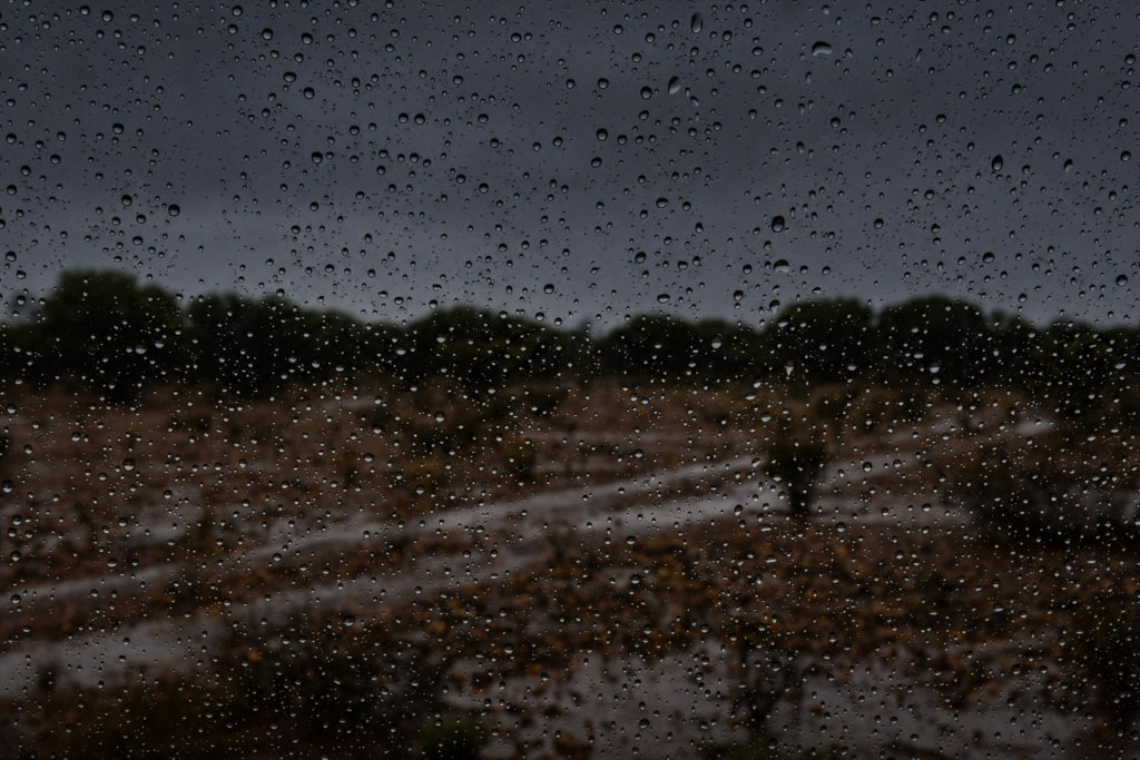 Rain Stopped Play Rain on a window looking out over a grey goldfields sky