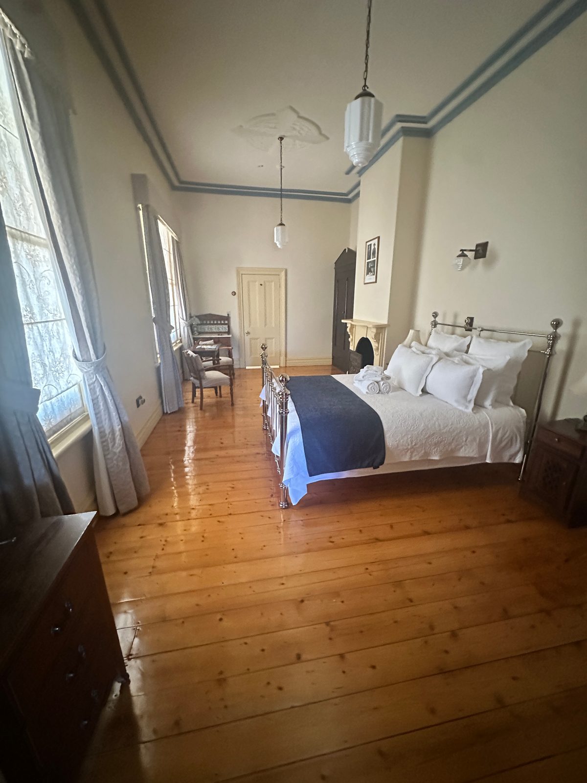 Kalgoorlie to Leonora: The Last Day of Never Having Swung a Detector Bedroom at Hoover House bed and breakfast with brass bed and polished timber floors