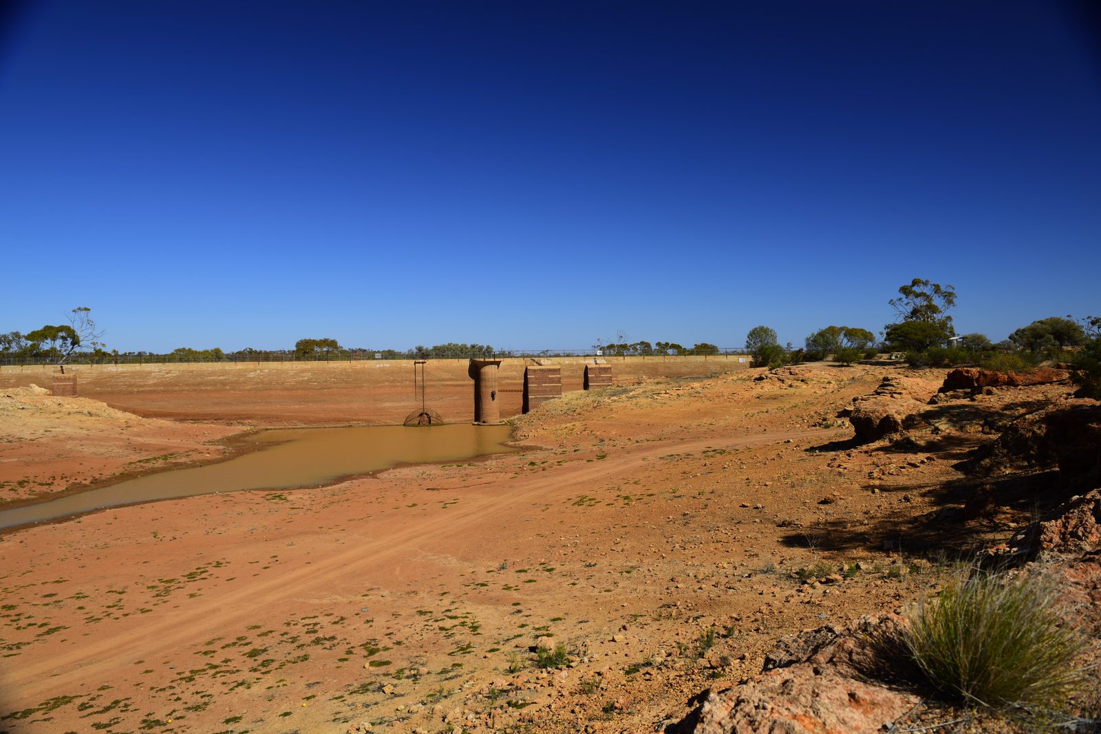 Kalgoorlie to Leonora: The Last Day of Never Having Swung a Detector Dry Niagara Dam with a small pool of water remaining in front of the dam wall