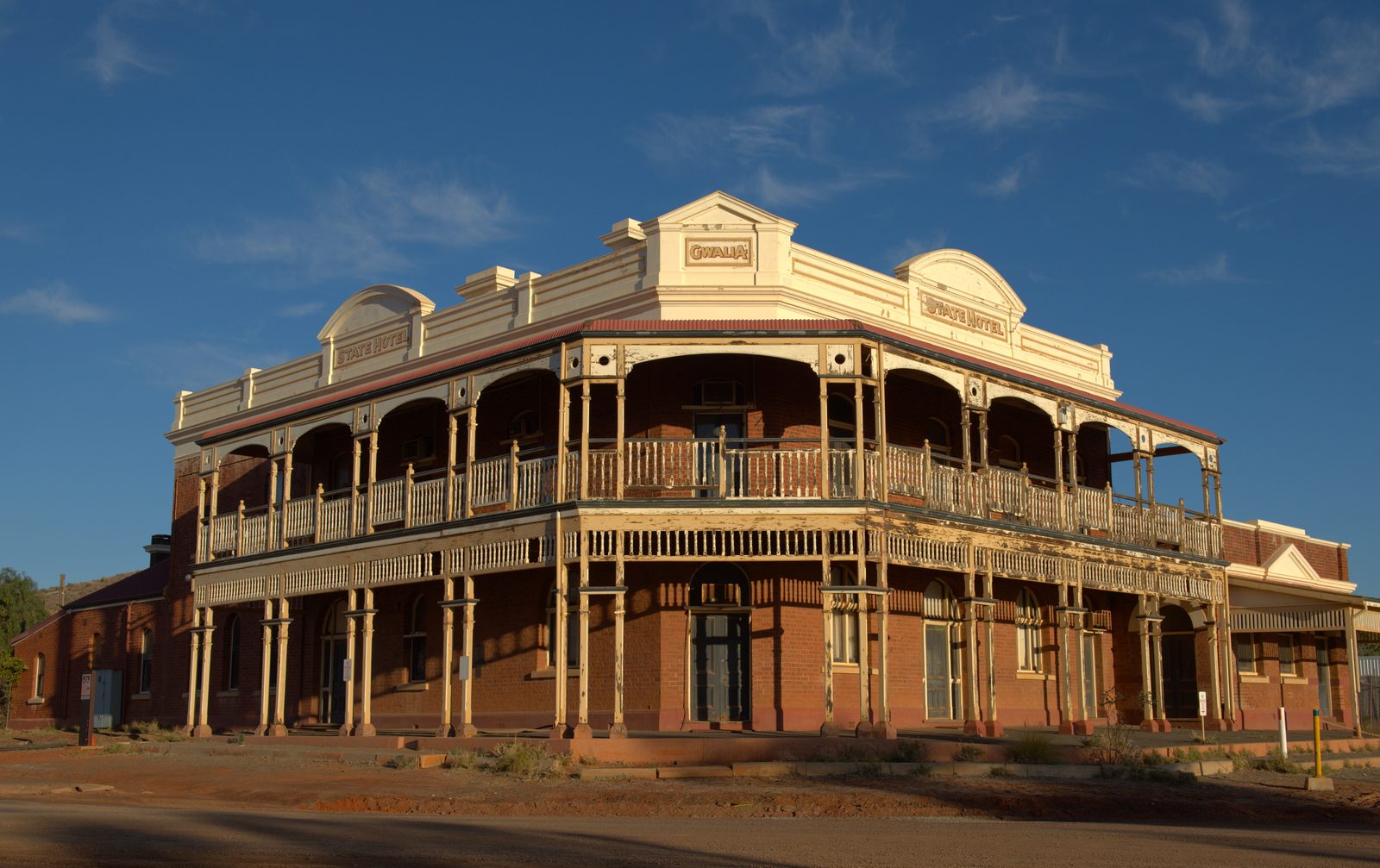 Kalgoorlie to Leonora: The Last Day of Never Having Swung a Detector Historic two-storey State Hotel building in Gwalia in evening light